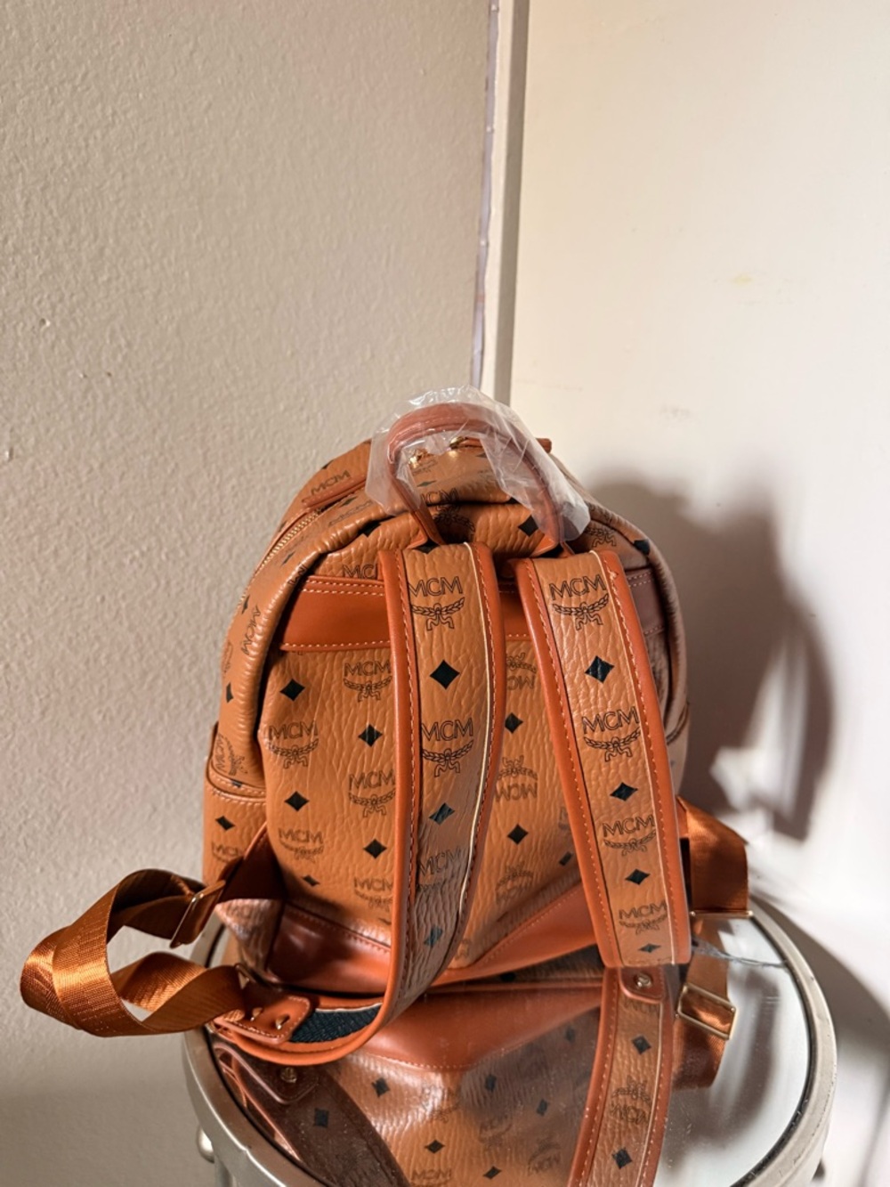 MCM Mini Backpack in Cognac with Black Logo Print and Gold Studs - Picture 2 of 2